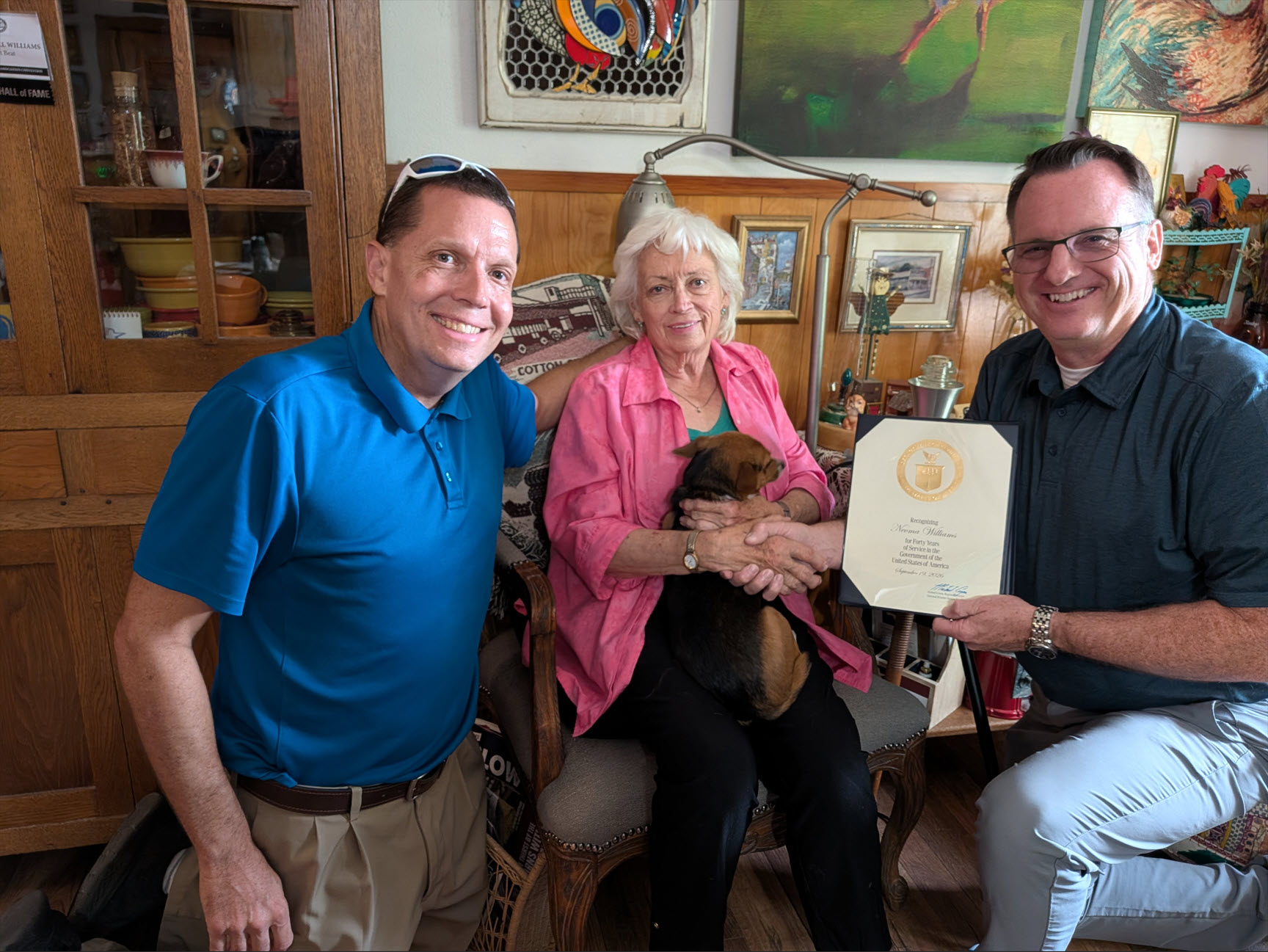 Neoma Williams receiving a 40-year Length of Service Award from Justin Weaver, the Meteorologist In Charge (MIC) of the National Weather Service (NWS) office in Lubbock, Texas. Also pictured is Gary Skwira, the Observing Program Leader (OPL) from NWS Lubbock.