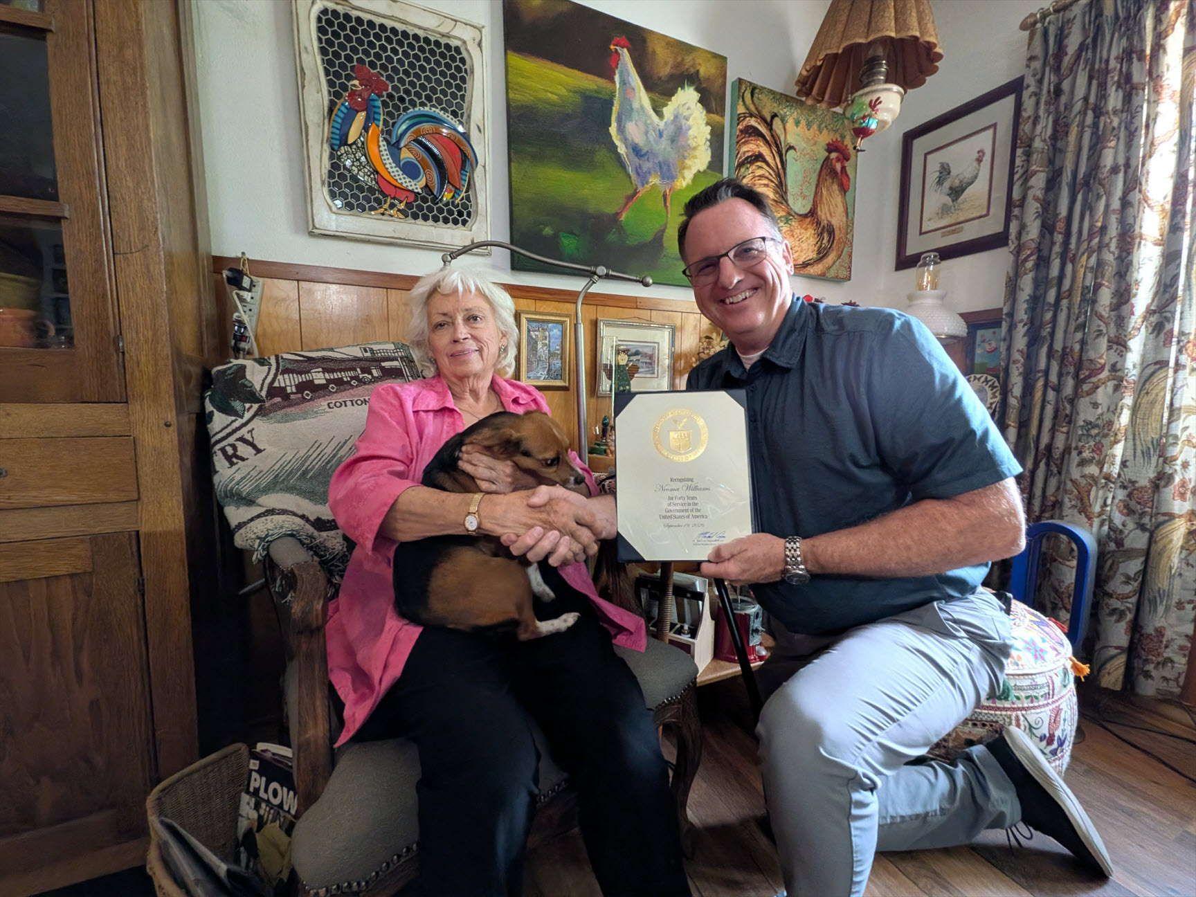 Neoma Williams receiving a 40-year Length of Service Award from Justin Weaver, the Meteorologist In Charge (MIC) of the National Weather Service (NWS) office in Lubbock, Texas.